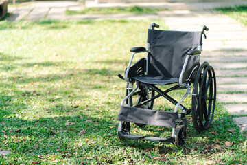 Fototapeta na wymiar wheelchair in the park  with copy space.
