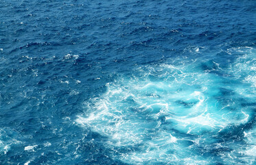 Abstract blue turquoise ocean water background.Sea waves natural texture for design.Selective focus.