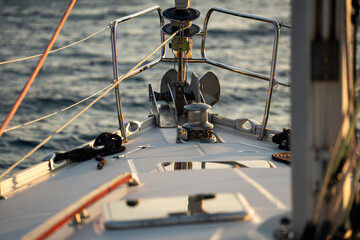 Sailing holiday in croatia at sunset in a bay with turquoise and blue water at summer with a beautiful light and amazing colors.