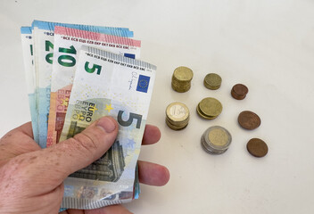 Euro banknotes on hand. Euro Money and cash background. Euro Money Banknotes for pay. Euro bills...