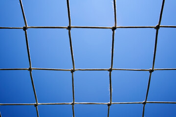 Sports net against blue sky