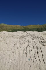 Vertical shot of a white sand mound quarry in Lonstrup, Denmark