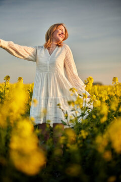 redhead girl in white in raps field