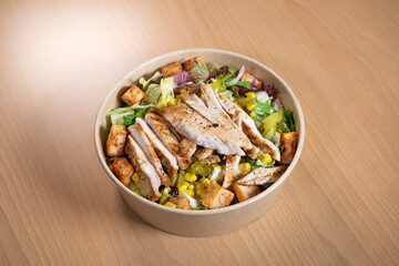 Grilled chicken breast, fillet and fresh vegetable salad of lettuce, arugula, spinach, cucumber and tomato. Healthy lunch menu. Diet food. Top view