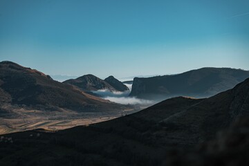 Stunning view of a mountain valley against the clear blue sky