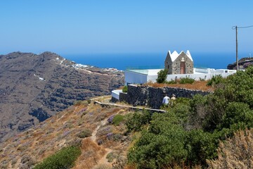 Old building in the coastal town of Oia in Santorini, Greece in summer on a sunny day