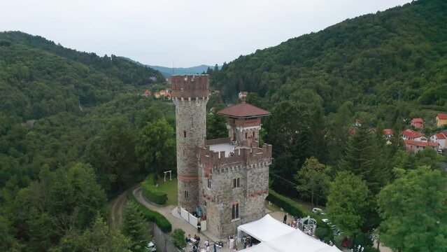 Aerial push-in toward historic Giacomo Becchi castle in Scoffera, Italy