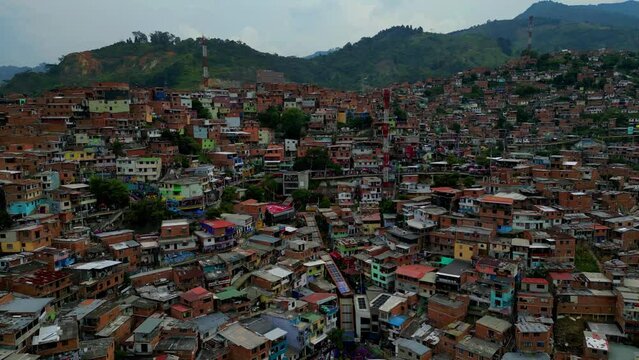 Comuna 13 Medellin Colombia escaleras electricas, graffiti and pablo escobar tour,  tourist attraction. 4k drone shot, view from above, favela barrio