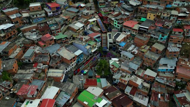 Comuna 13 Medellin Colombia escaleras electricas, graffiti and pablo escobar tour,  tourist attraction. 4k drone shot, view from above
