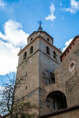 Low angle shot of the tower of Albarracin Cathedral in Teruel, Aragon, Spain