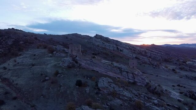 Drone view over Zafra Castle on rocky mountain in Campillo de Duenas in Spain at sunset