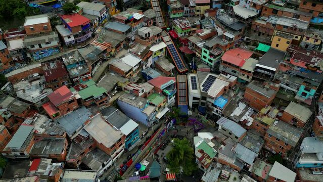 Comuna 13 Medellin Colombia escaleras electricas, graffiti and pablo escobar tour,  tourist attraction. 4k drone shot
