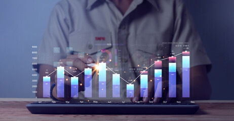 Analysts work with computers in Business Analytics and Data Management Systems to create reports...
