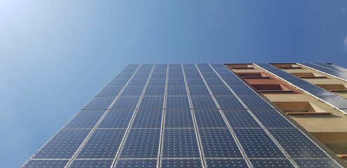 Low angle of a modern building in Germany with sky on the background