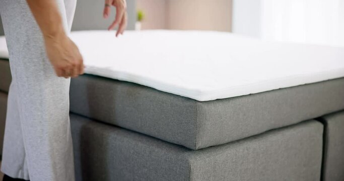 Mattress Topper Being Laid On Top