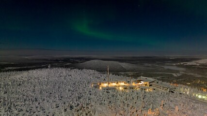 Northern lights, moon light, winter night in Syote, Finland