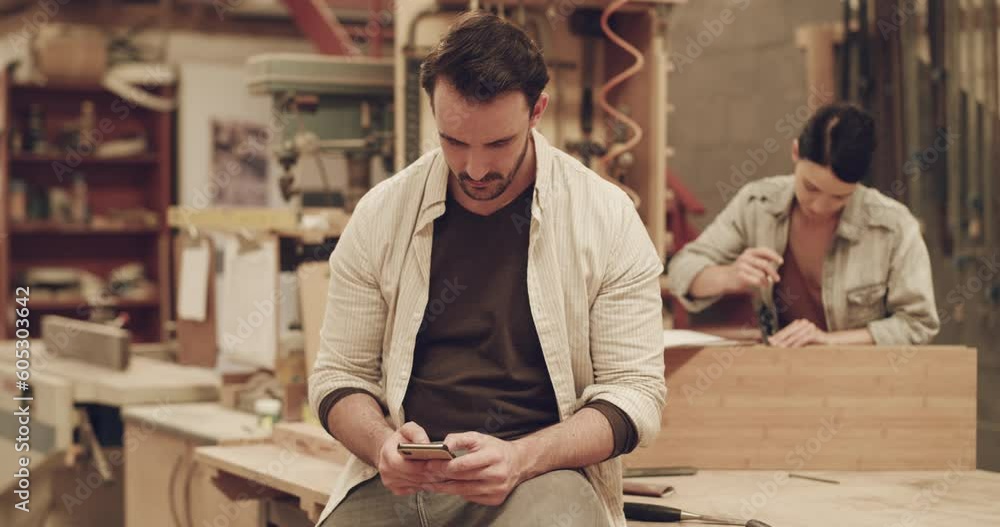 Aufkleber man, phone and internet connection for carpentry order in a workshop or small business. male carpent