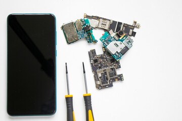 Closeup shot of a smartphone and its parts on the white background