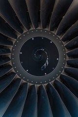 Vertical close-up of the jet engine round and powerful turbine blades © Chris Fowler/Wirestock Creators