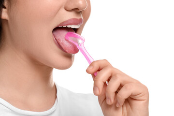 Woman brushing her tongue with cleaner on white background, closeup
