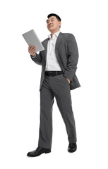 Businessman in suit with tablet on white background, low angle view