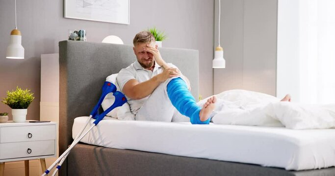 Man With Broken Leg Fracture Injury And Cast