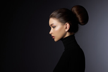 Fashion art studio portrait of beautiful elegant woman in black turtleneck. Hair high beam, perfect...