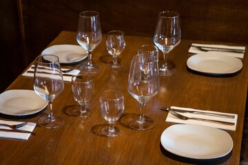 High angle shot of clean dishware organized on a brown table