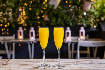 Closeup of two glasses of orange juice