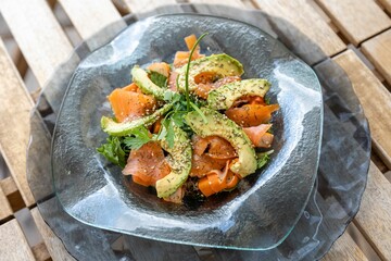 Closeup of a dish with salmon and avocado