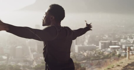 Running, celebration and man outdoor for fitness training, workout goal or exercise achievement on city mountain. Athlete, runner and happiness for sports success, motivation and freedom in nature