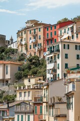 Fototapeta na wymiar Outdoor view of residential buildings in the town of Riomaggiore, Cinque Terre in Italy