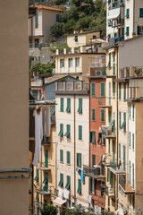 Fototapeta na wymiar Outdoor view of residential buildings in the town of Riomaggiore, Cinque Terre in Italy