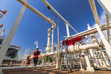 Naklejka premium Male worker inspection at valve of visual check record pipeline oil and gas