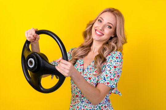 Photo of charming automobile safety insurance blonde promoter woman wear stylish summer shirt drive car isolated on yellow color background