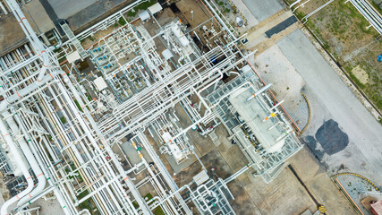 Obraz premium Top view steel long pipes and valve pipe elbow in station oil factory