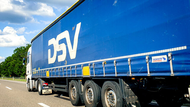 Truck of Danish transport and logistics company DSV Panalpina. Blue Background with white letters, May 2020