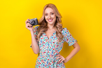 Photo of cheerful charming woman dressed flower print sarafan smiling tacking photo isolated yellow color background