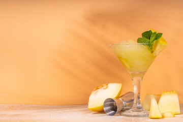 Sweet summer liquor with melon, lime and mint. Frozen melon martini or daiquiri cocktail with bar...