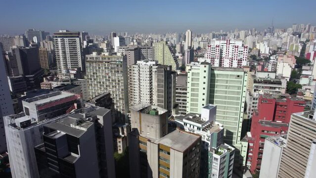 Drone shot roating over vibrant building in Consolacao, sunny Sao Paulo, Brazil