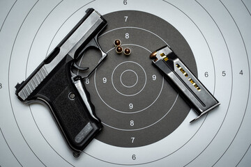 German 9mm pistol and shooting range target.
