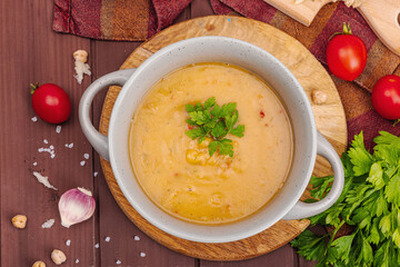 Chickpea-tomato cream soup with fragrant garlic buns. Comfort food, nostalgic mood concept