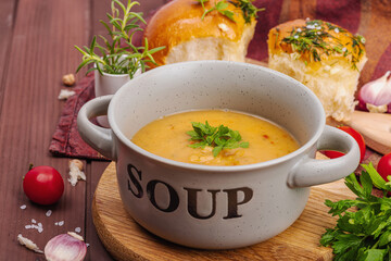 Chickpea-tomato cream soup with fragrant garlic buns. Comfort food, nostalgic mood concept