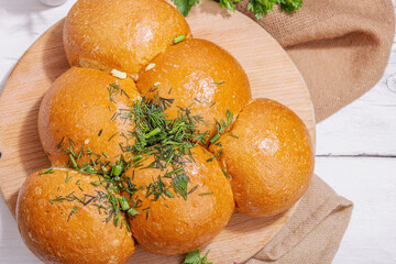 Aromatic garlic buns. Fresh baked goods, a traditional gluten-free soup snack. Parsley, spices