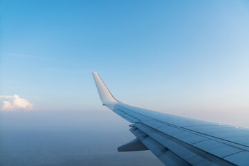 Fototapeta na wymiar View from airplane window on the wing