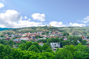 Fototapeta na wymiar Scenic beautiful view panorama landscape of old town Tbilisi, Georgia in summer sunny day, park in mountains