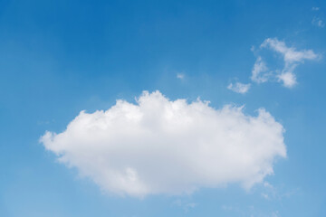 Single white cloud on blue sky