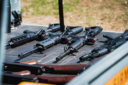 Firearms, m4a1 and ak47 rifles in the car trailer.