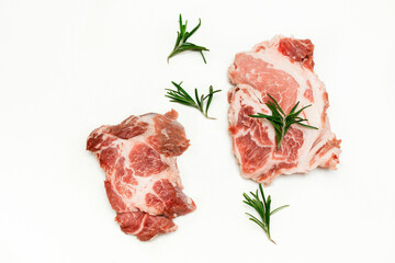 Fresh raw beef meat steaks with rosemary isolated on white background, copy space, food cooking at home, top view