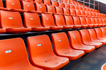 Fototapeta premium Empty orange seat in stadium
